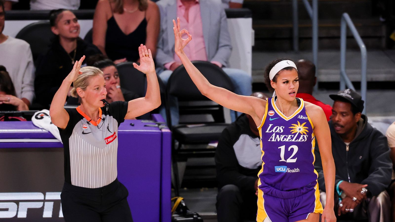 Rae Burrell celebrates a three-pointer against the Fever