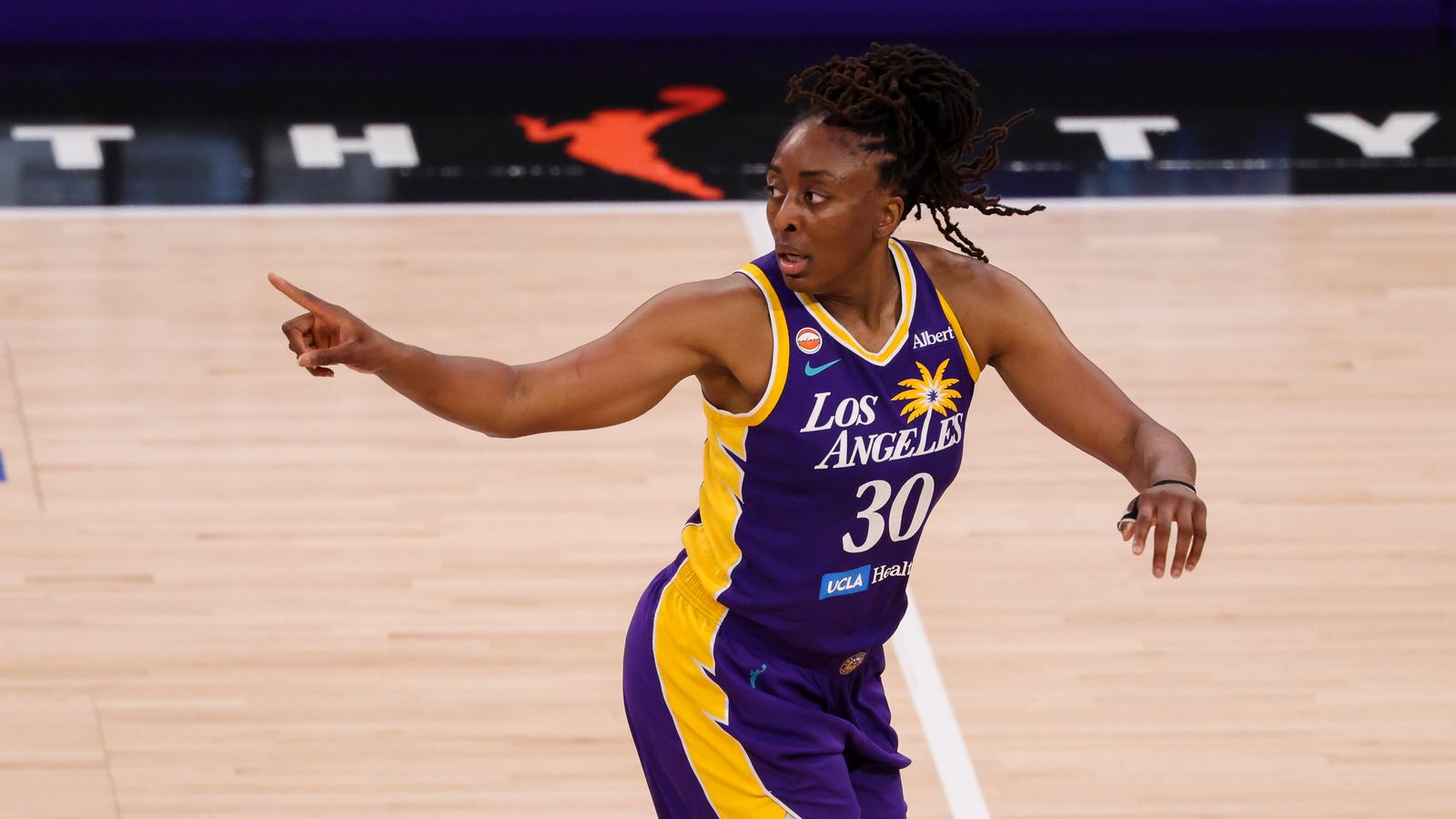 Nneka Ogwumike celebrates after a shot in Los Angeles