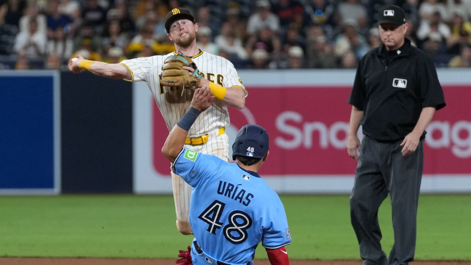 Luis Urias slides to second base in game against Padres