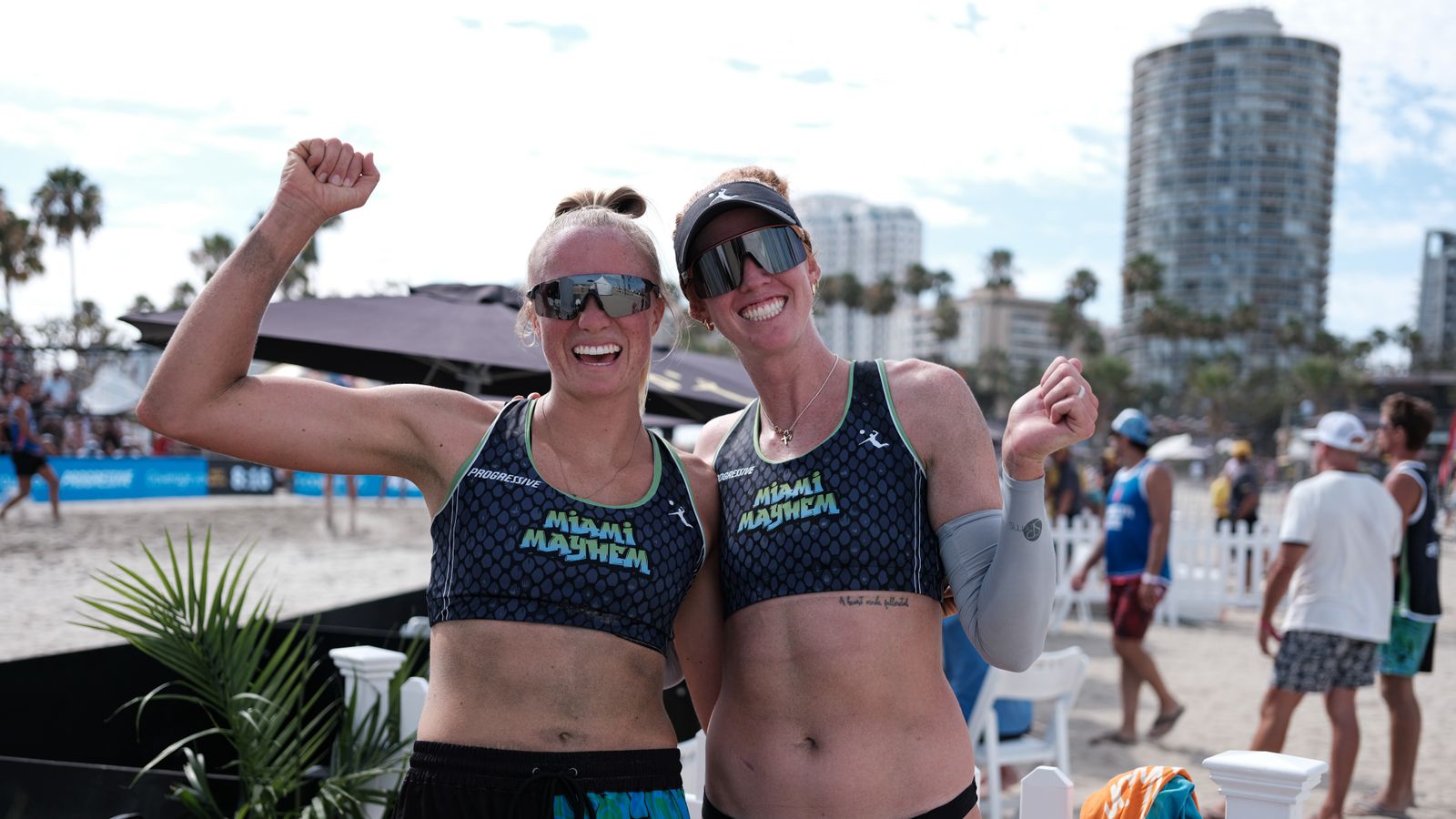 Victorious pose from Kelly Cheng and Megan Kraft after their win