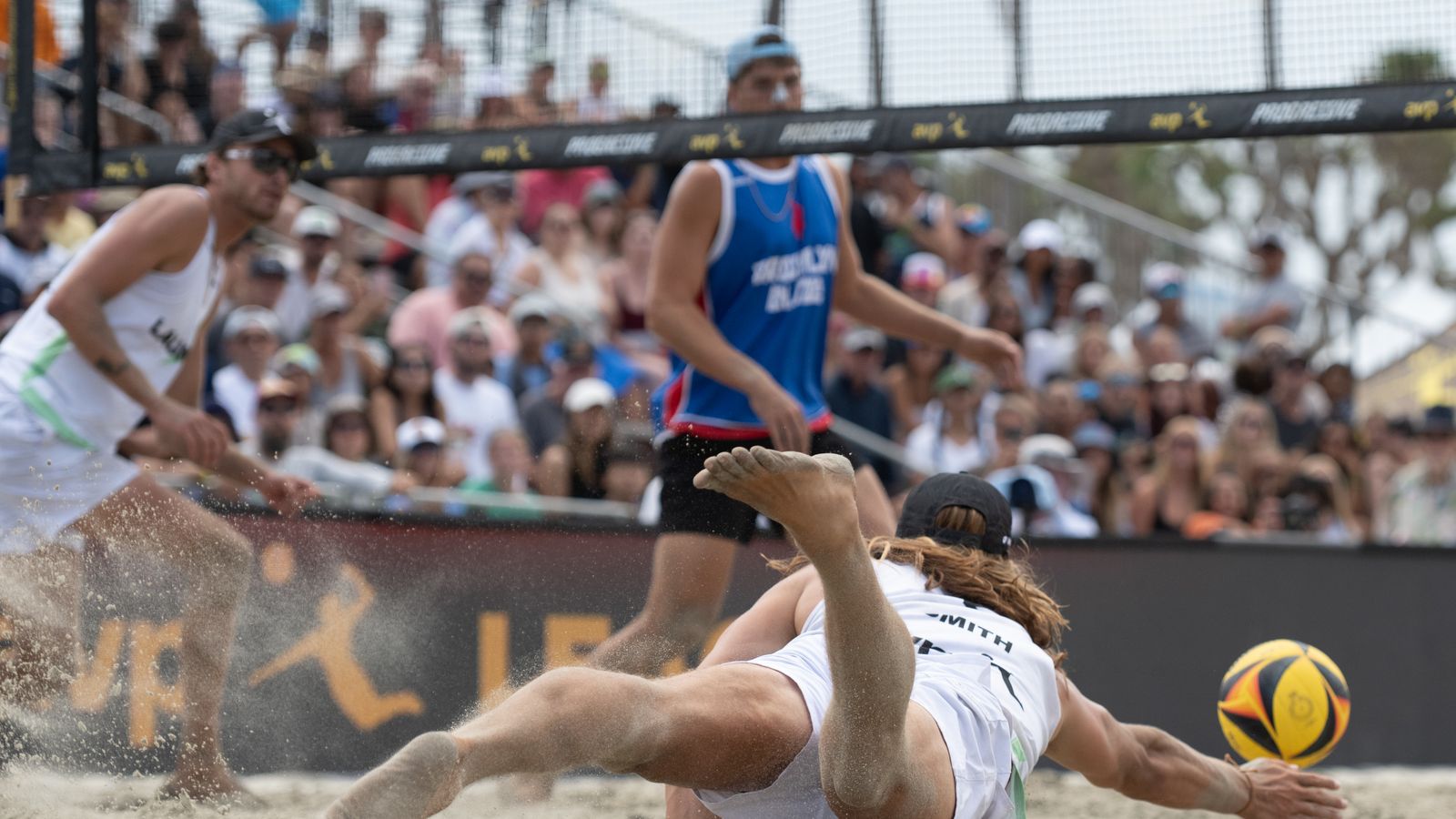 Hagen Smith dives to keep the ball in play at AVP Long Beach