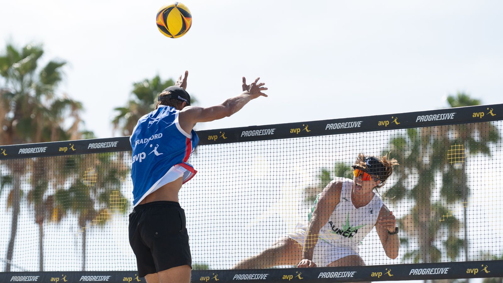 Hagen Smith spikes the ball during AVP Long Beach match
