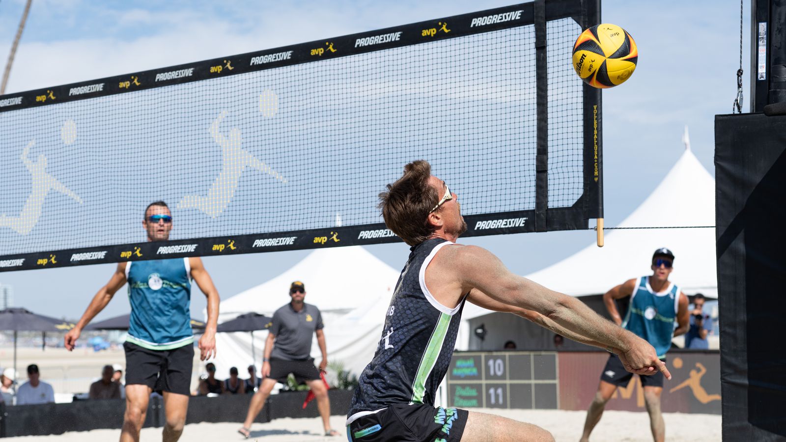 Taylor Crabb chases the ball at AVP Long Beach 2026