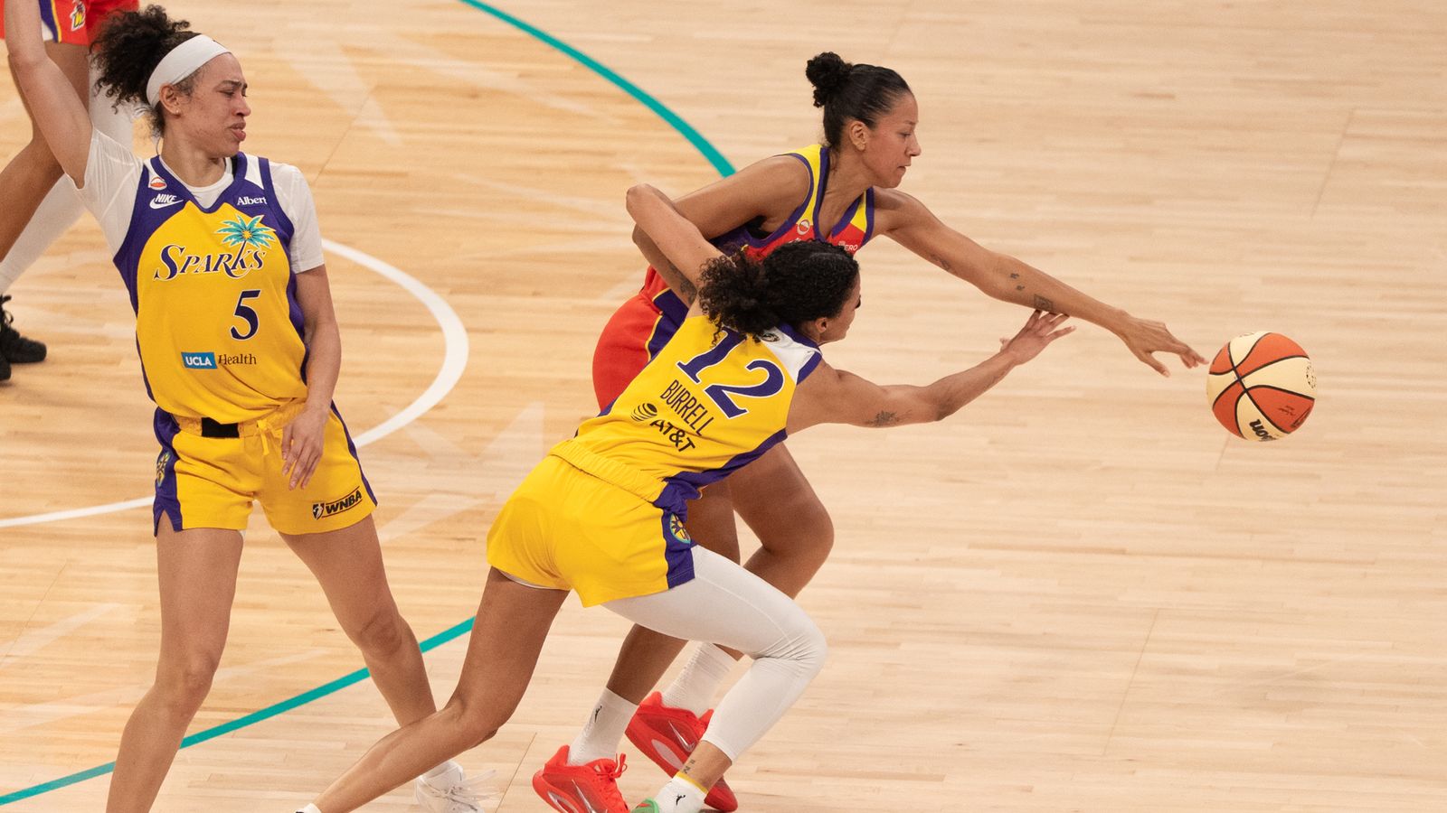 Rae Burrell fights for a loose ball vs. Mercury