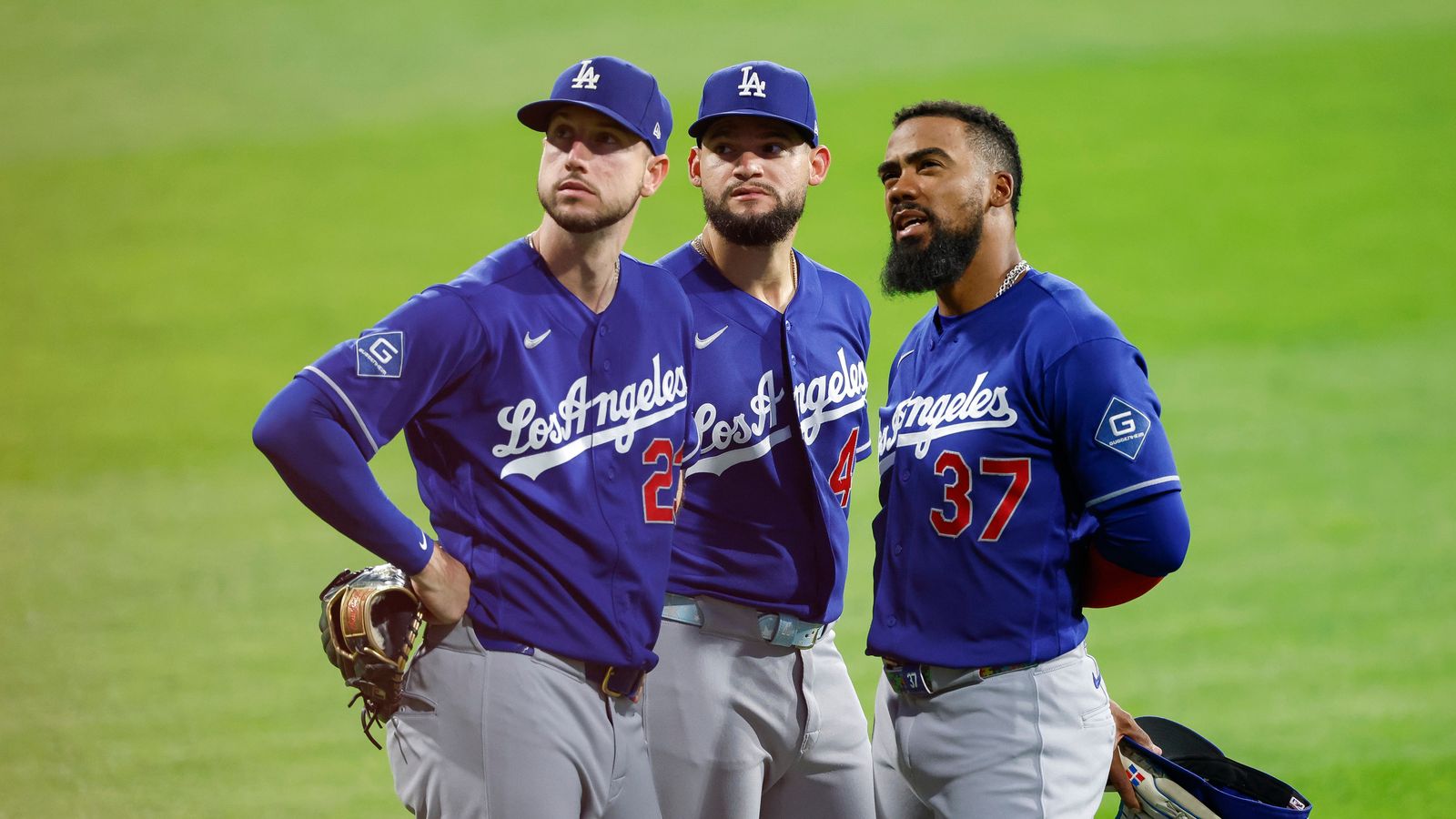 Dodgers outfielders gather during the game against Phillies