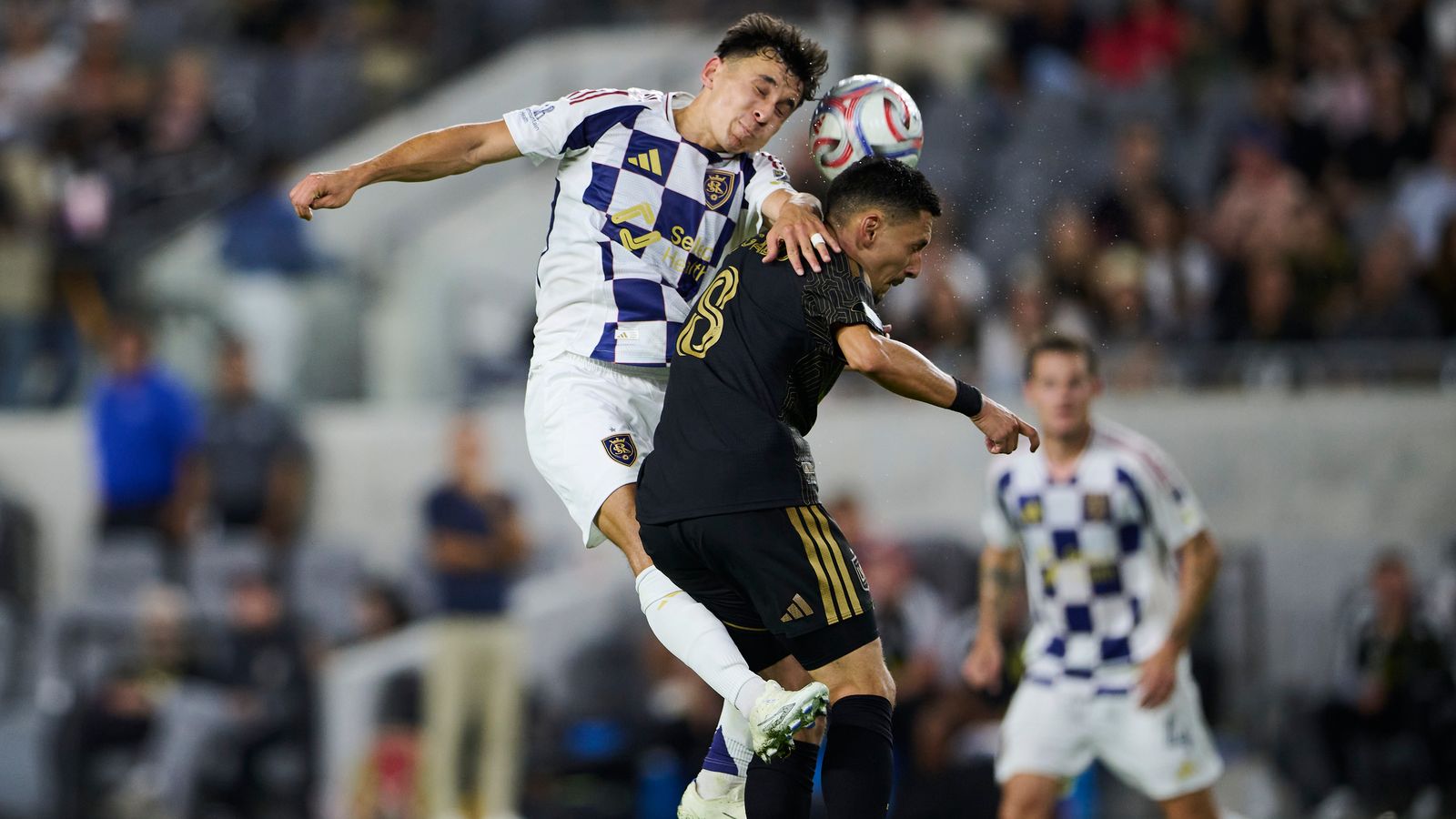 Mark Delgado jumps for the ball in LAFC vs RSL game