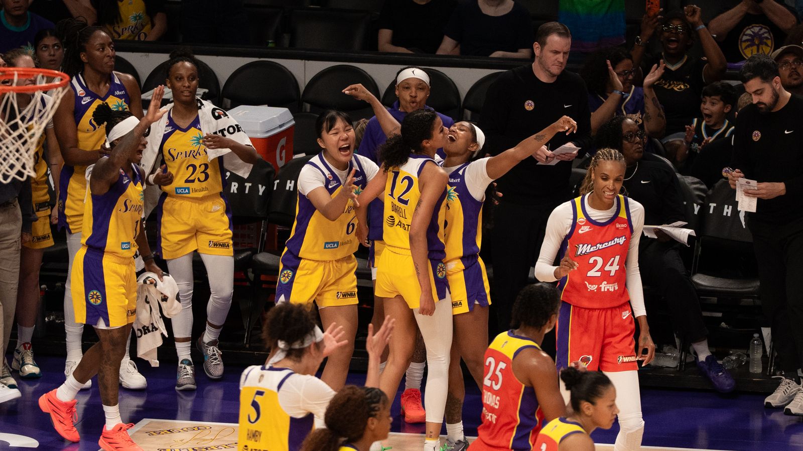 Sparks bench celebrates a buzzer beater vs. Mercury