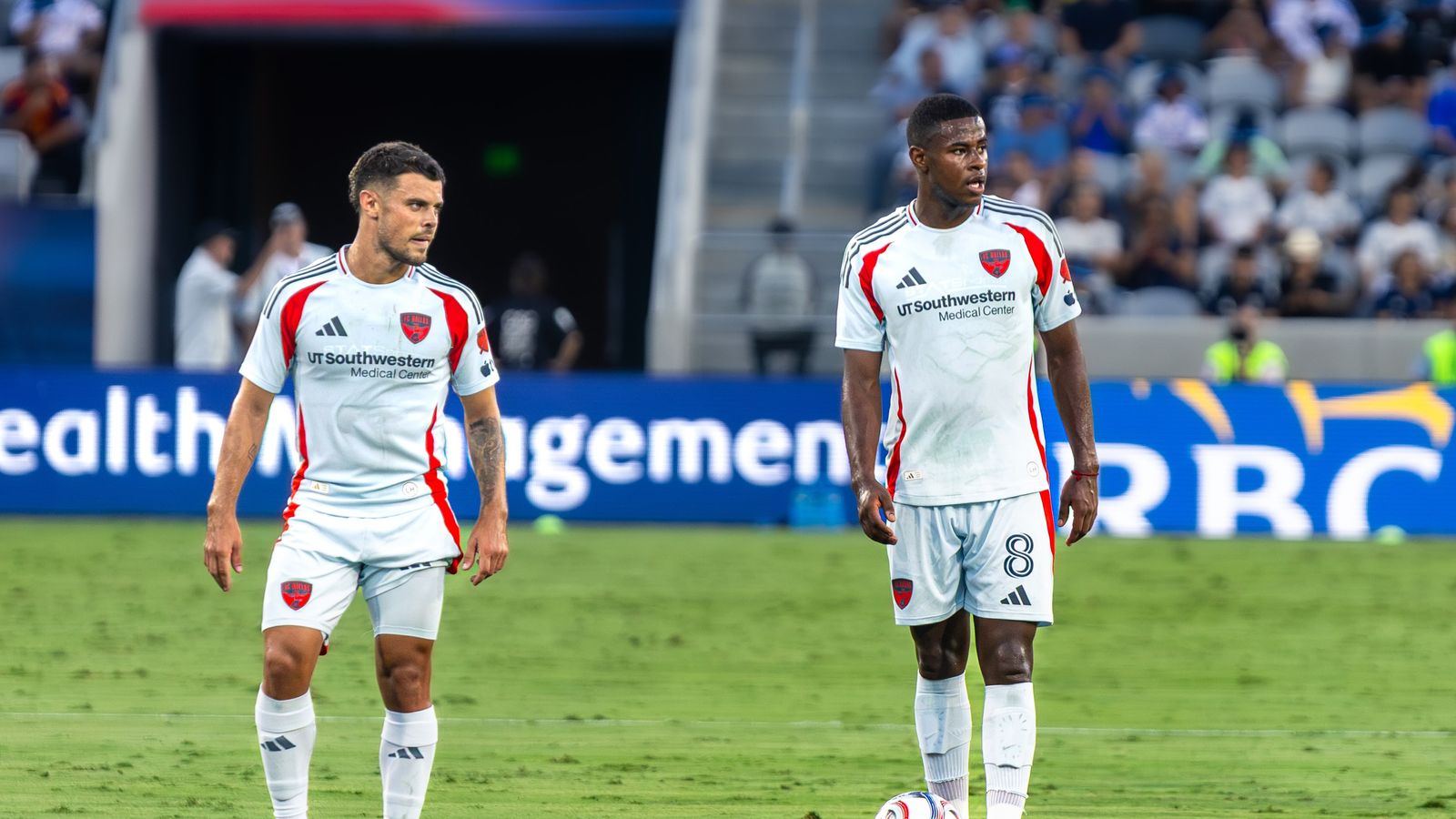 Valiente and Delgado prepare for a crucial free kick in the MLS game.