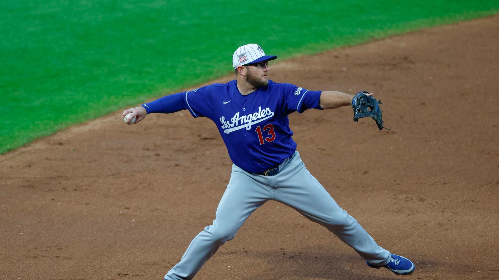 Max Muncy throws to first base at Citi Field, July 25, 2026