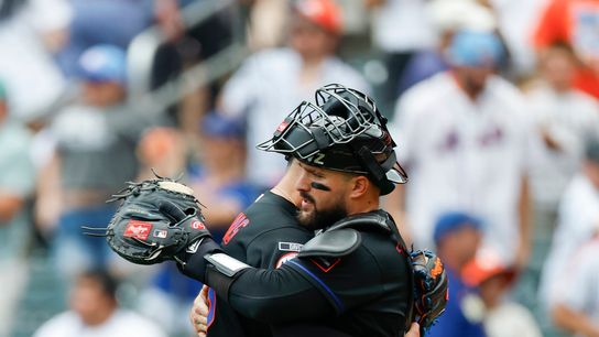 Devin Williams and Luis Torrens celebrate Mets' victory.