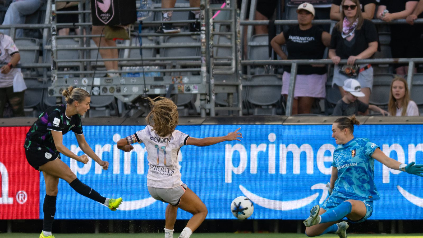 Angelina Anderson attempts a save against Racing Louisville's Kayla Fischer