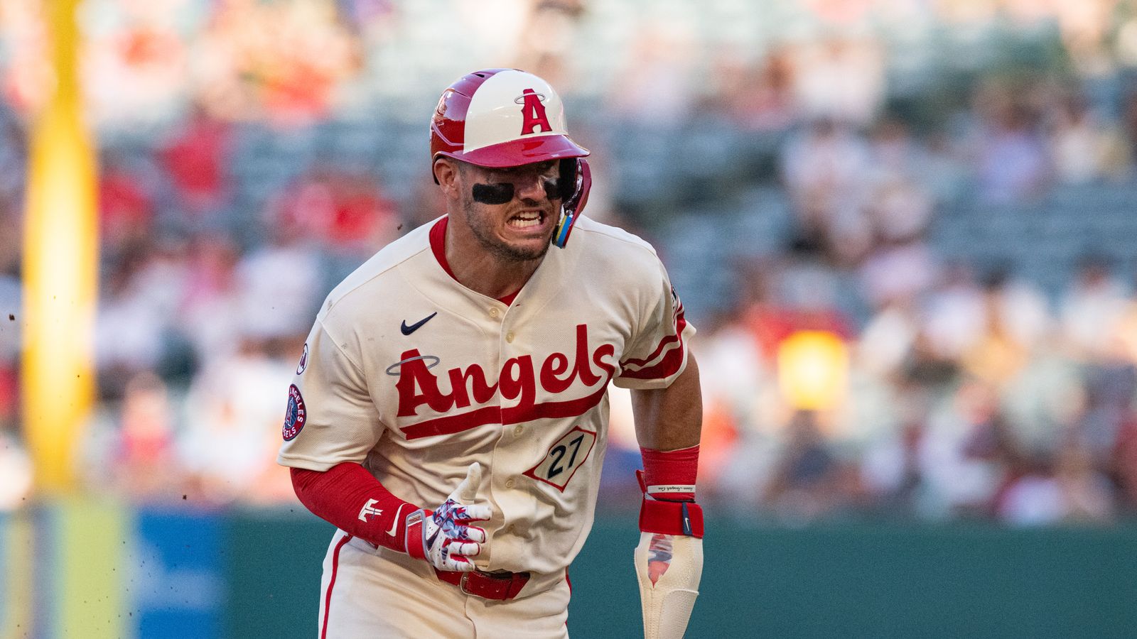 Mike Trout dashes to third base in a tight game