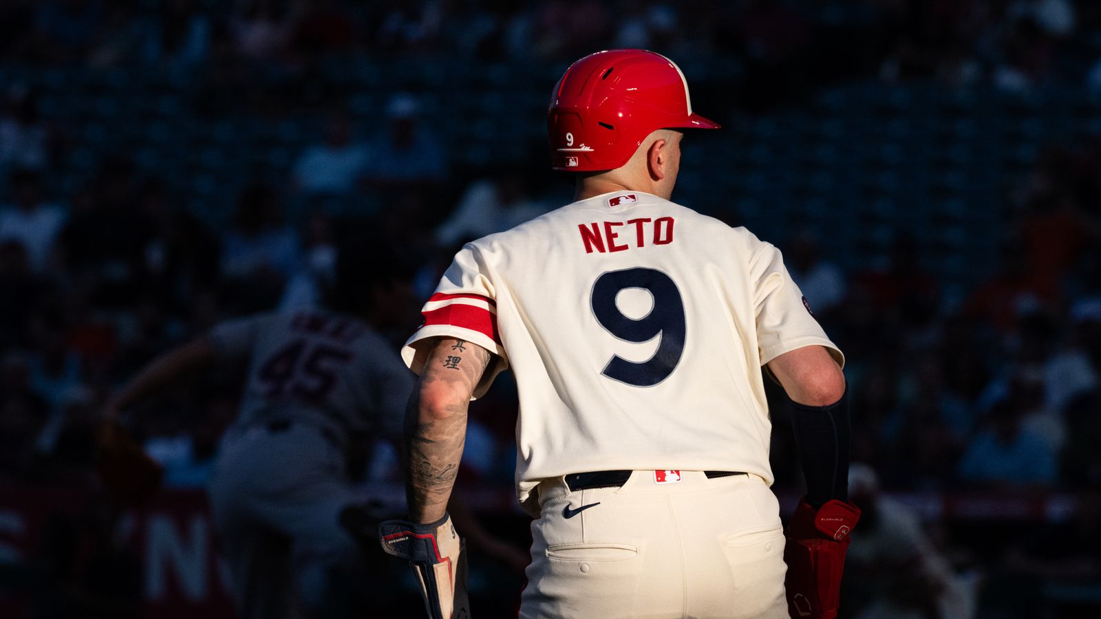 Zach Neto stands ready at third base during the game