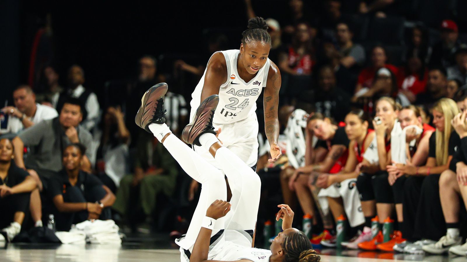 Jewell Loyd assists Chelsea Gray after a foul