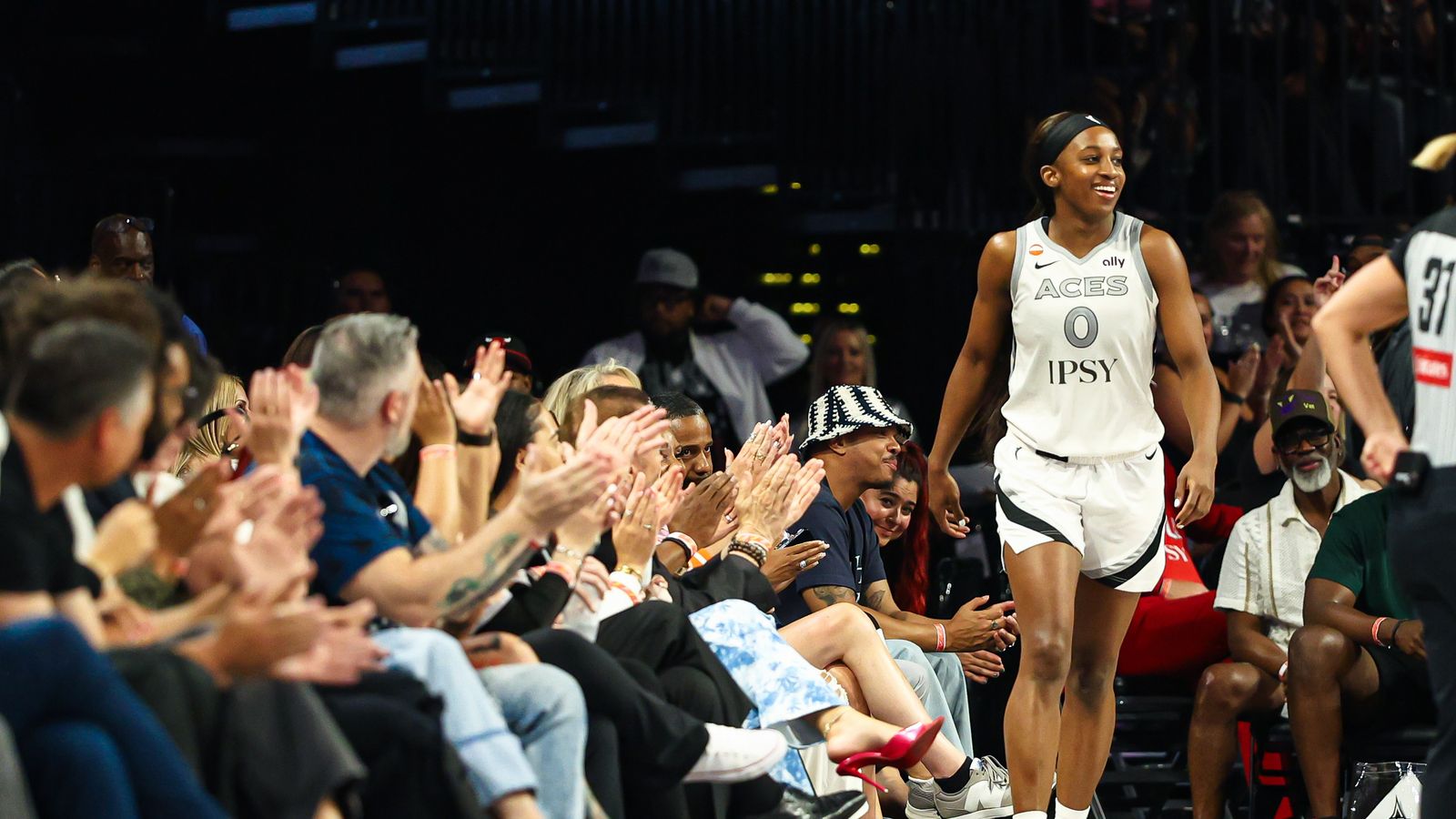 Jackie Young draws a foul with a bright smile