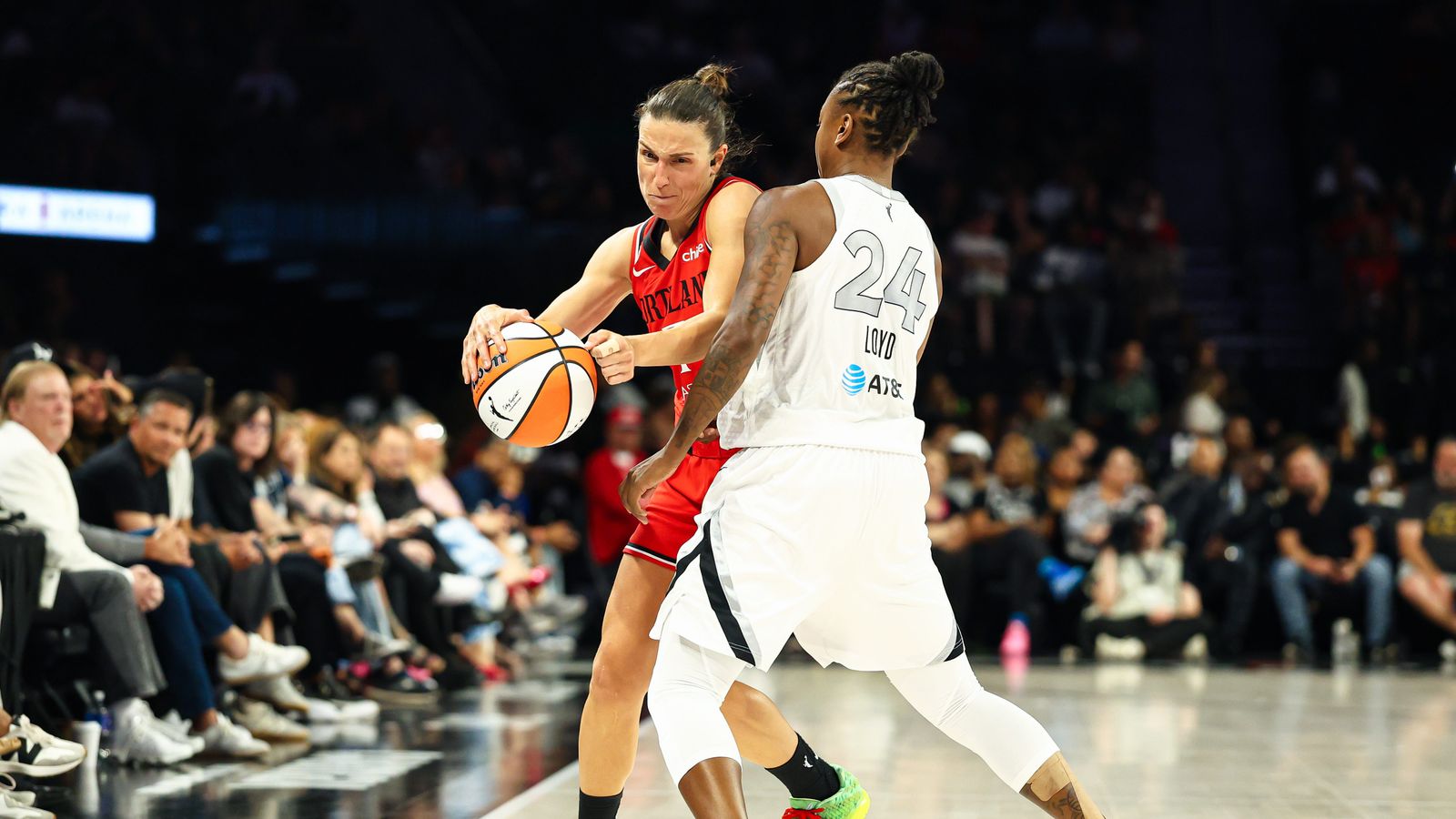 Teja Oblak fouls Jewell Loyd in a tense game moment