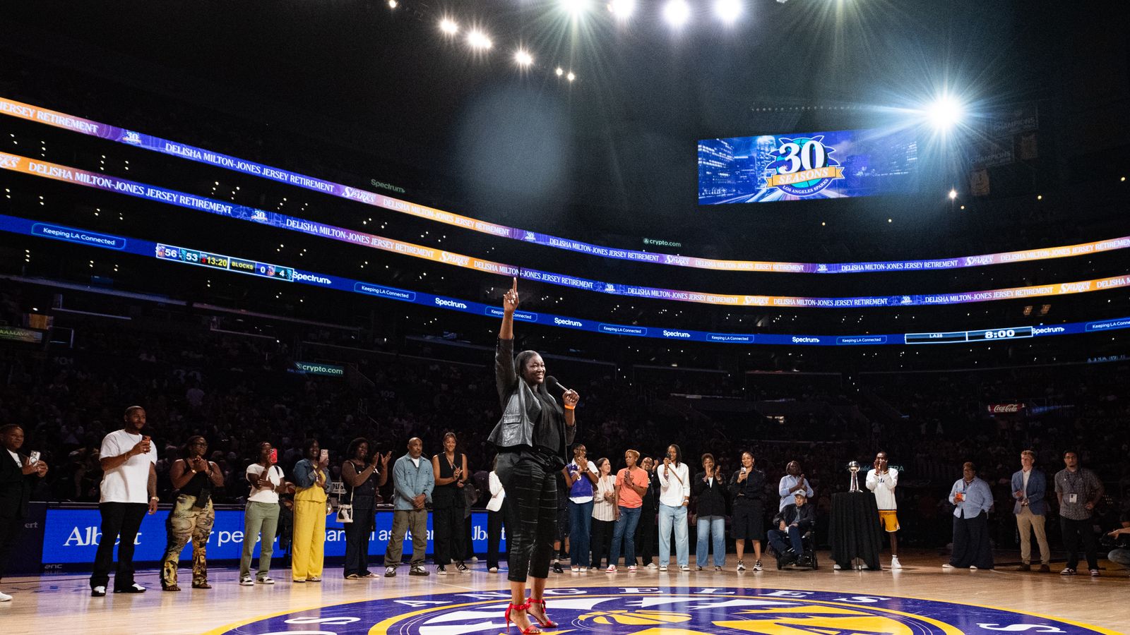 DeLisha Milton-Jones speaks during her jersey retirement ceremony