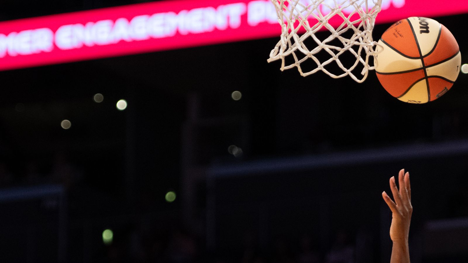 Ariel Atkins takes a layup in a fast-paced WNBA game