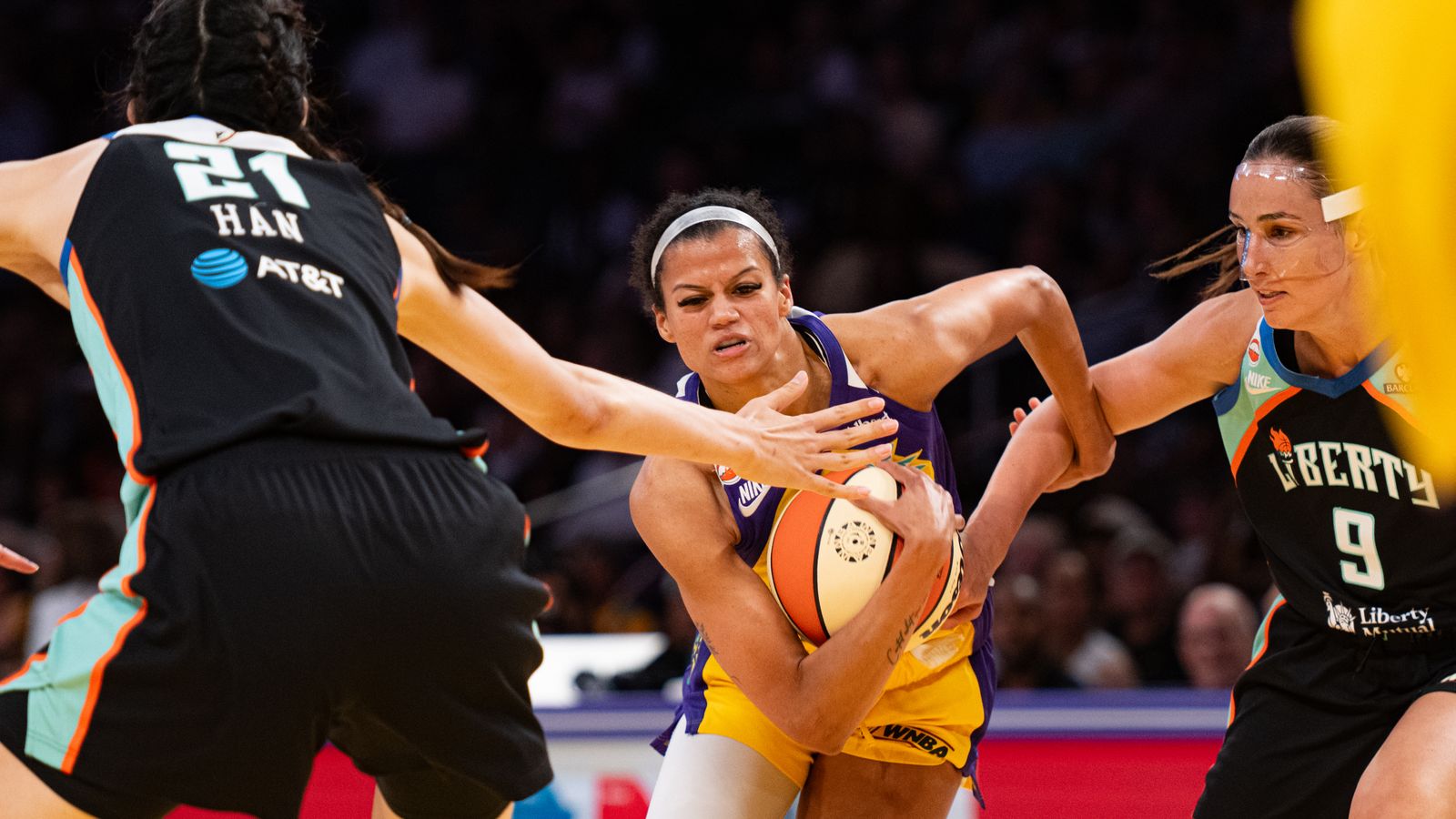 Rae Burrell protects the ball against NY Liberty defense