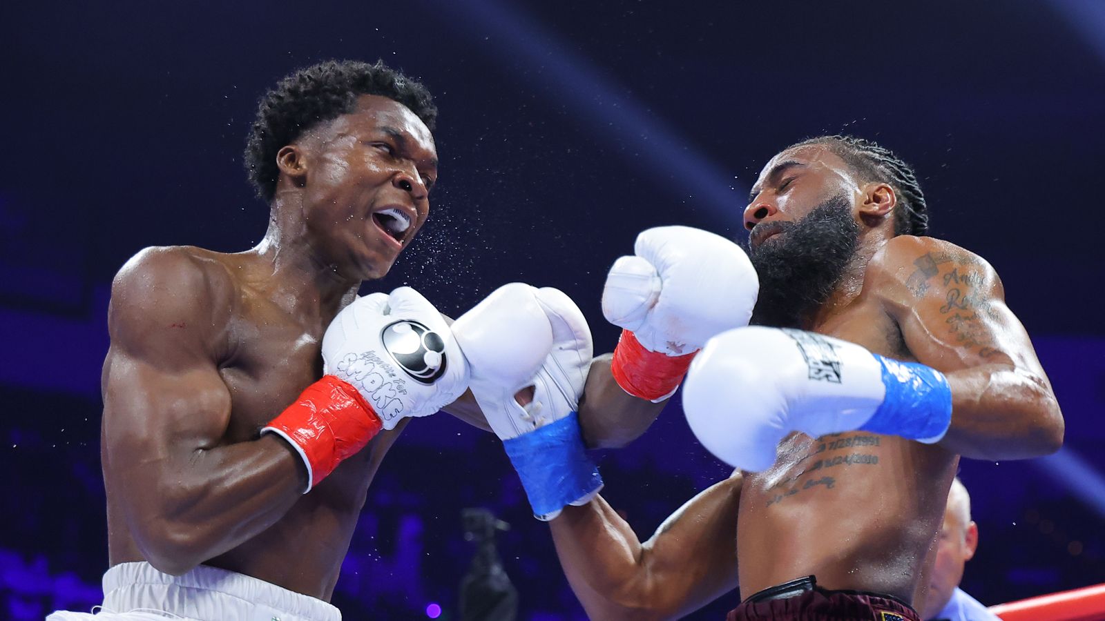 Abdullah Mason connects with a left hand on Albert Bell as the fight begins to turn in his favor.