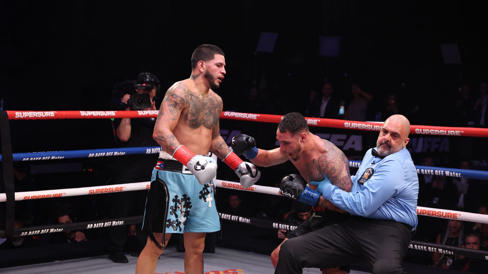 Referee intervenes to stop the fight, saving Butler from further damage