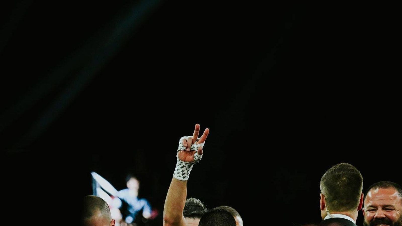 Tim Tszyu raises his hand in victory after defeating Errol Spence Jr.