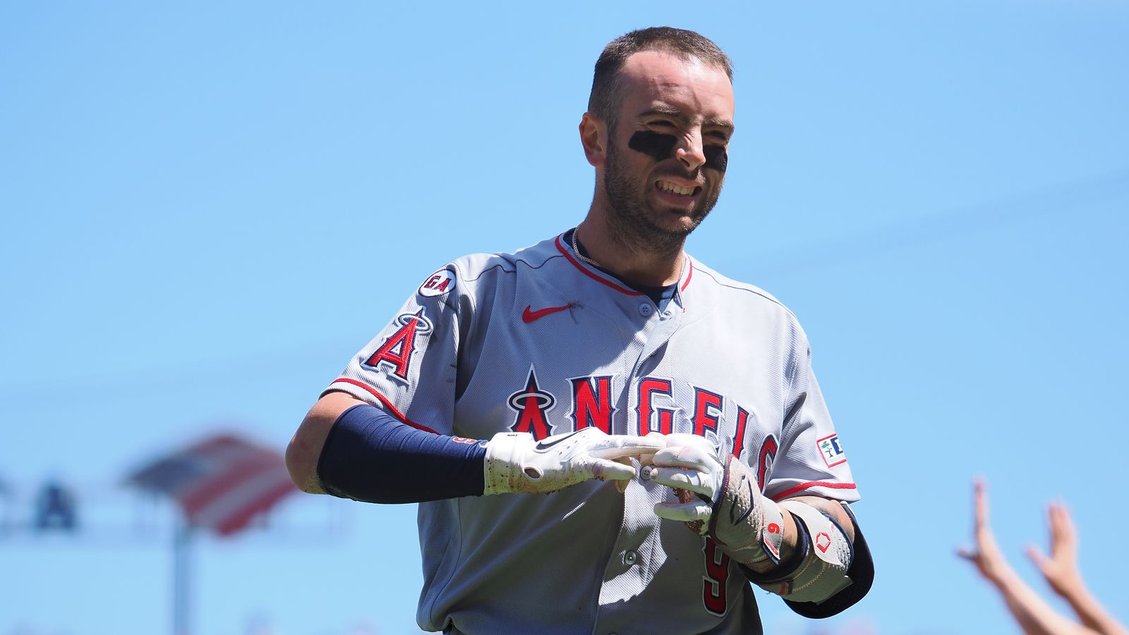 Zach Neto reacts to being hit by a pitch in the seventh inning