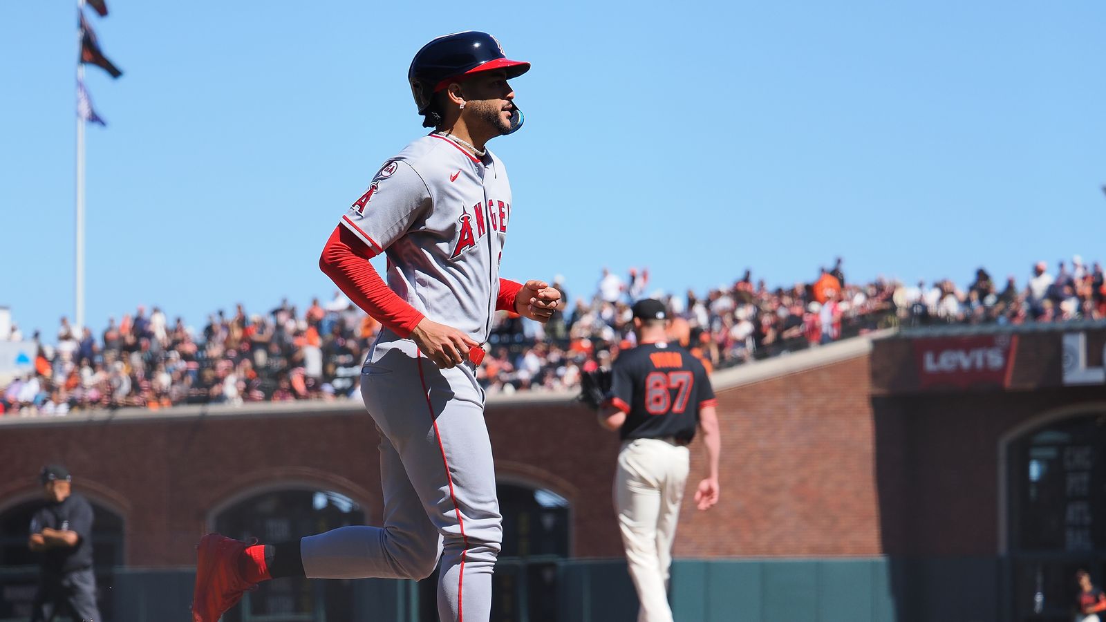 Jose Siri walks to first base after a bases-loaded walk in the ninth