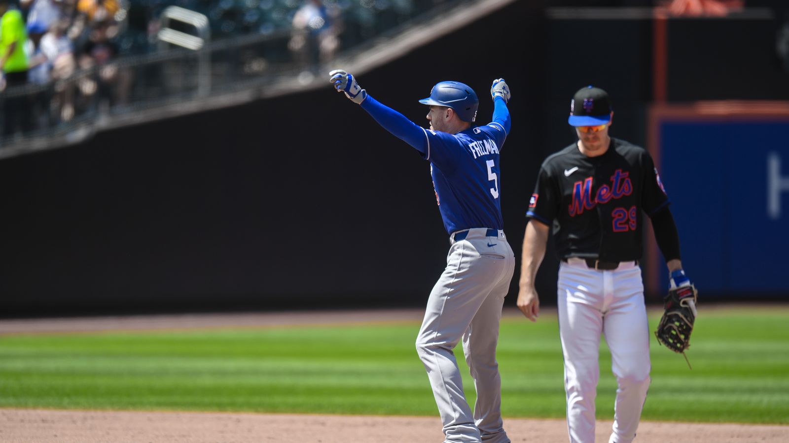 Freddie Freeman hits a crucial RBI double against the Mets at Citi Field.