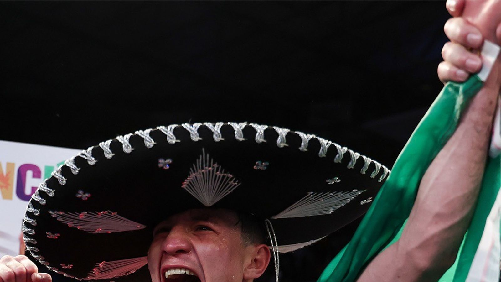 William Zepeda celebrates a victory with the Mexican flag