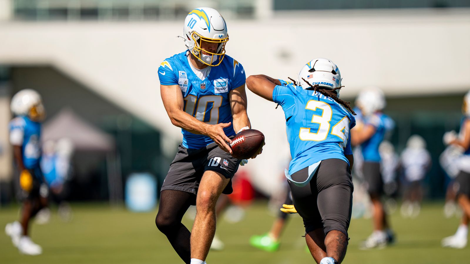 Justin Herbert and Keaton Mitchell Practice Handoff