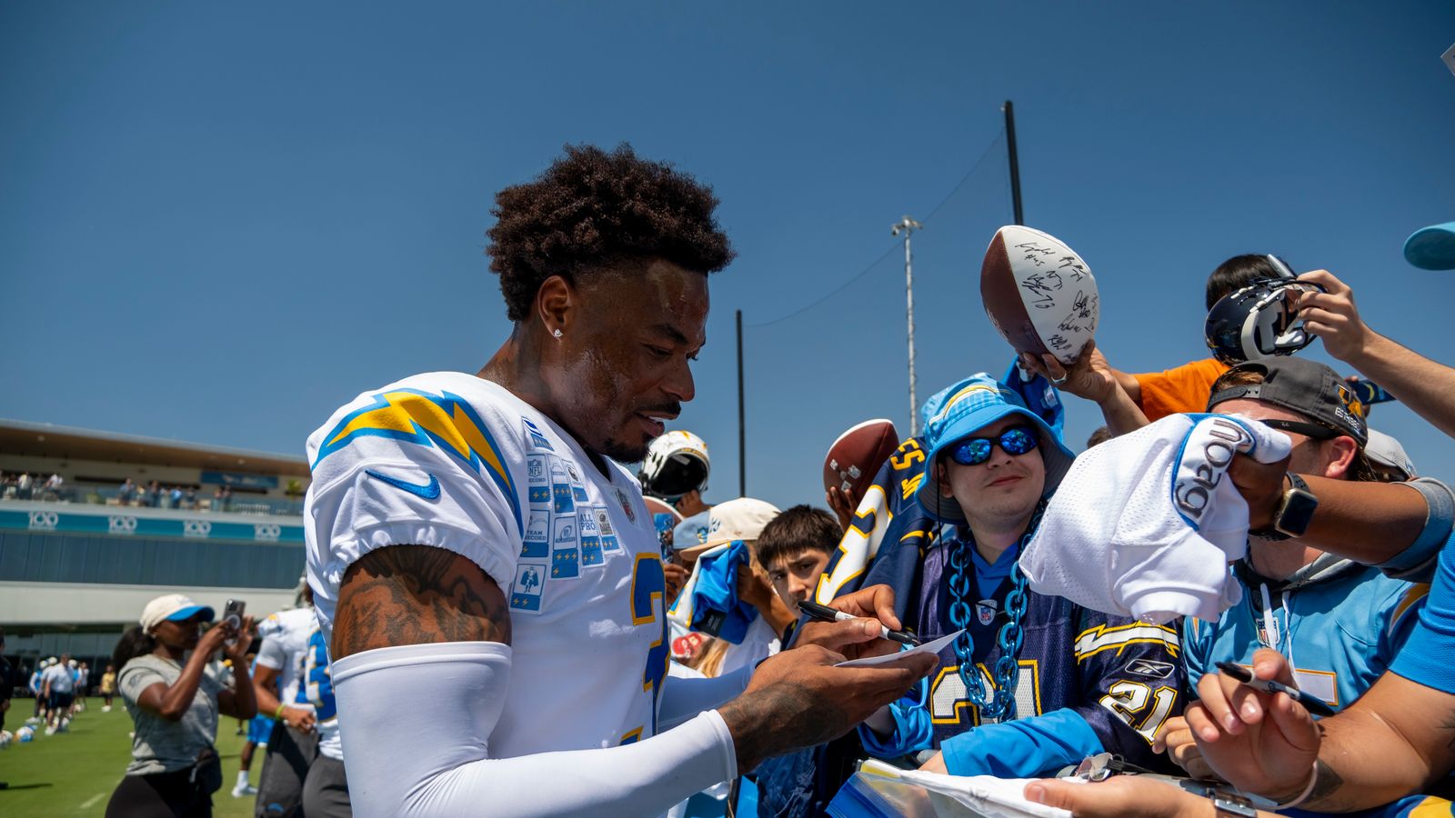 Derwin James Jr. Signs Merchandise for Fans