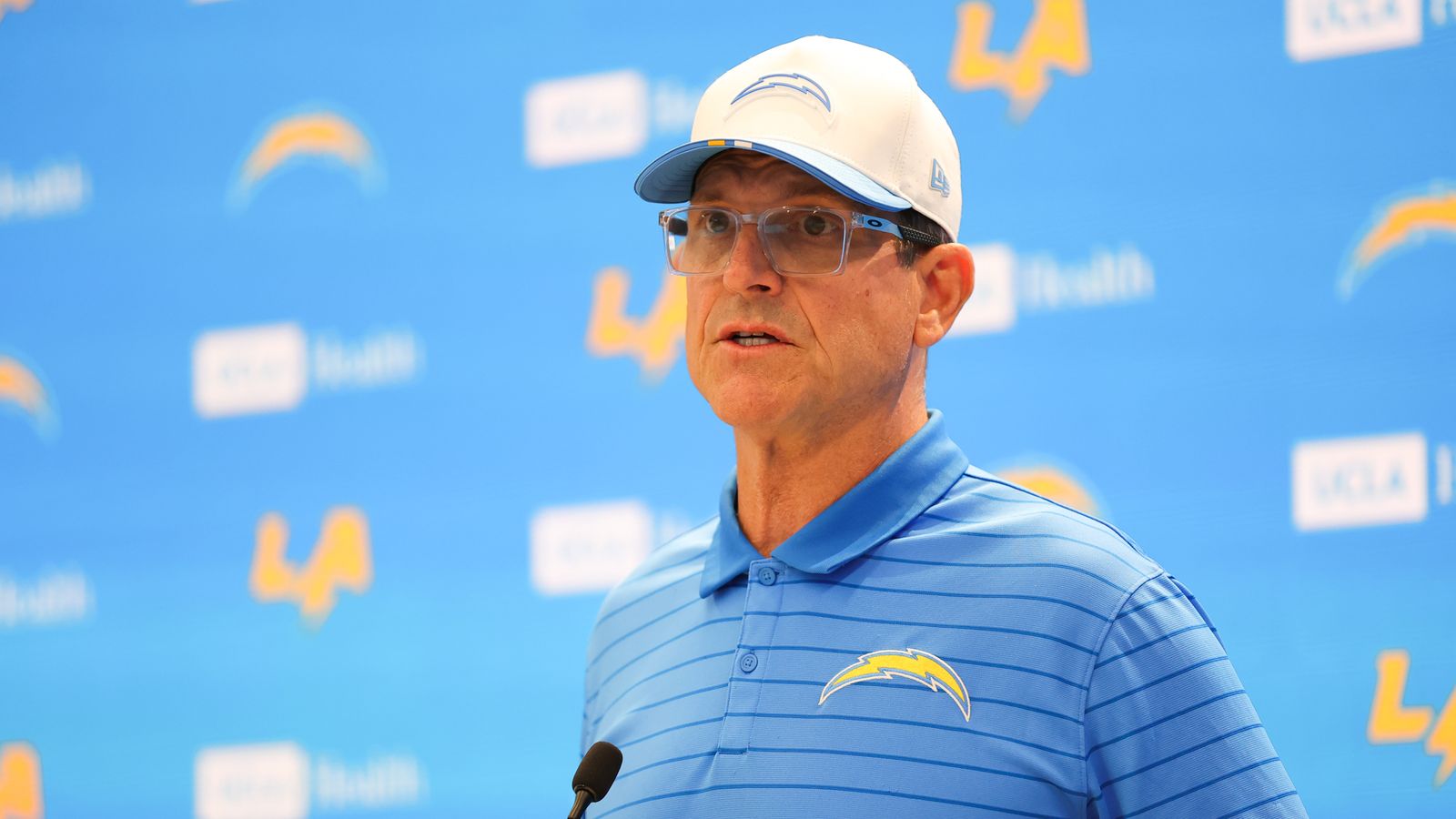 Coach Jim Harbaugh discusses Chargers strategies with media
