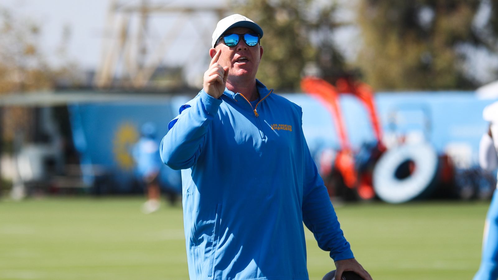 Safeties coach Adam Fuller leads drills at Chargers camp