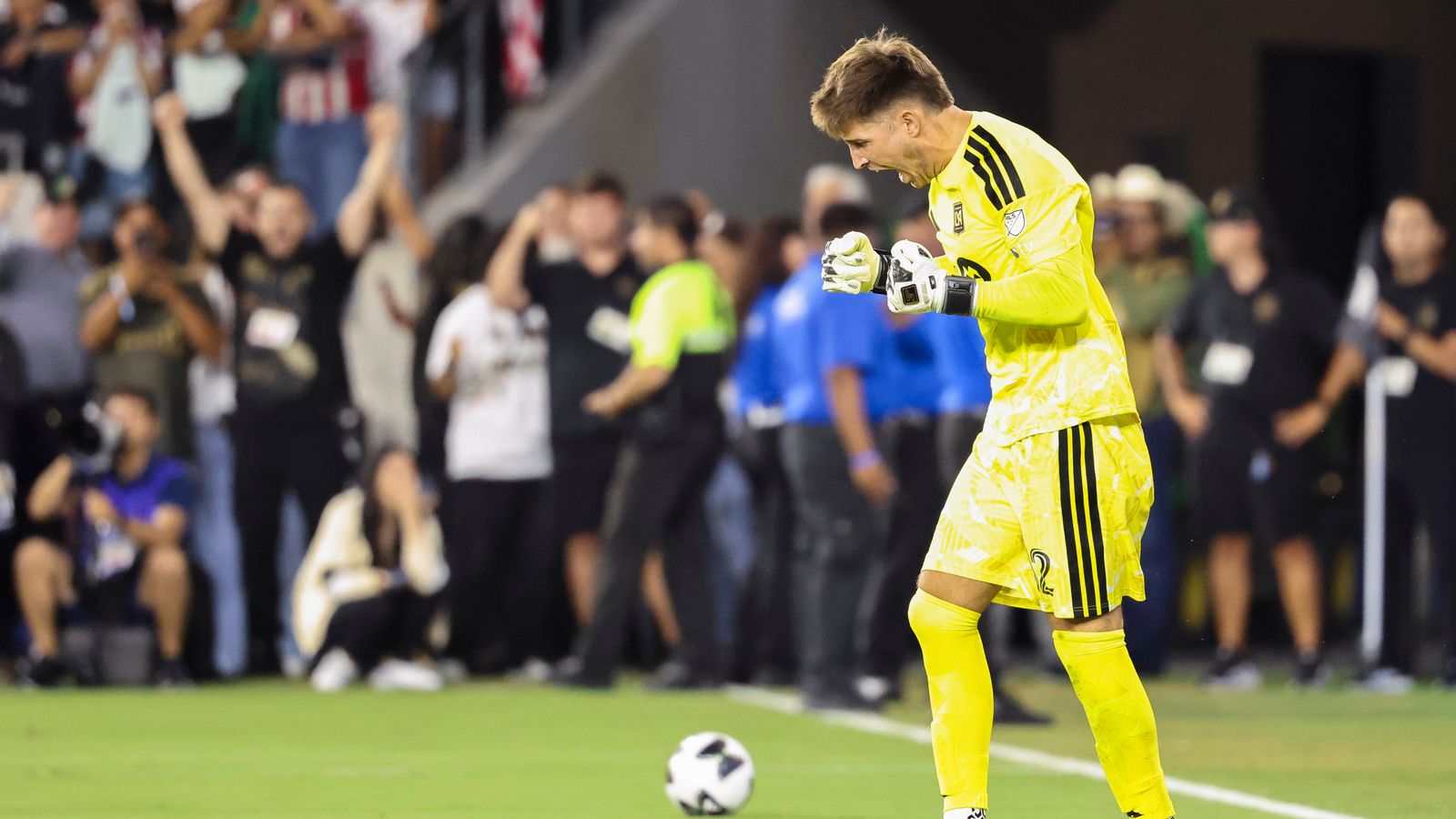 Goalkeeper Thomas Hasal celebrates a saved penalty