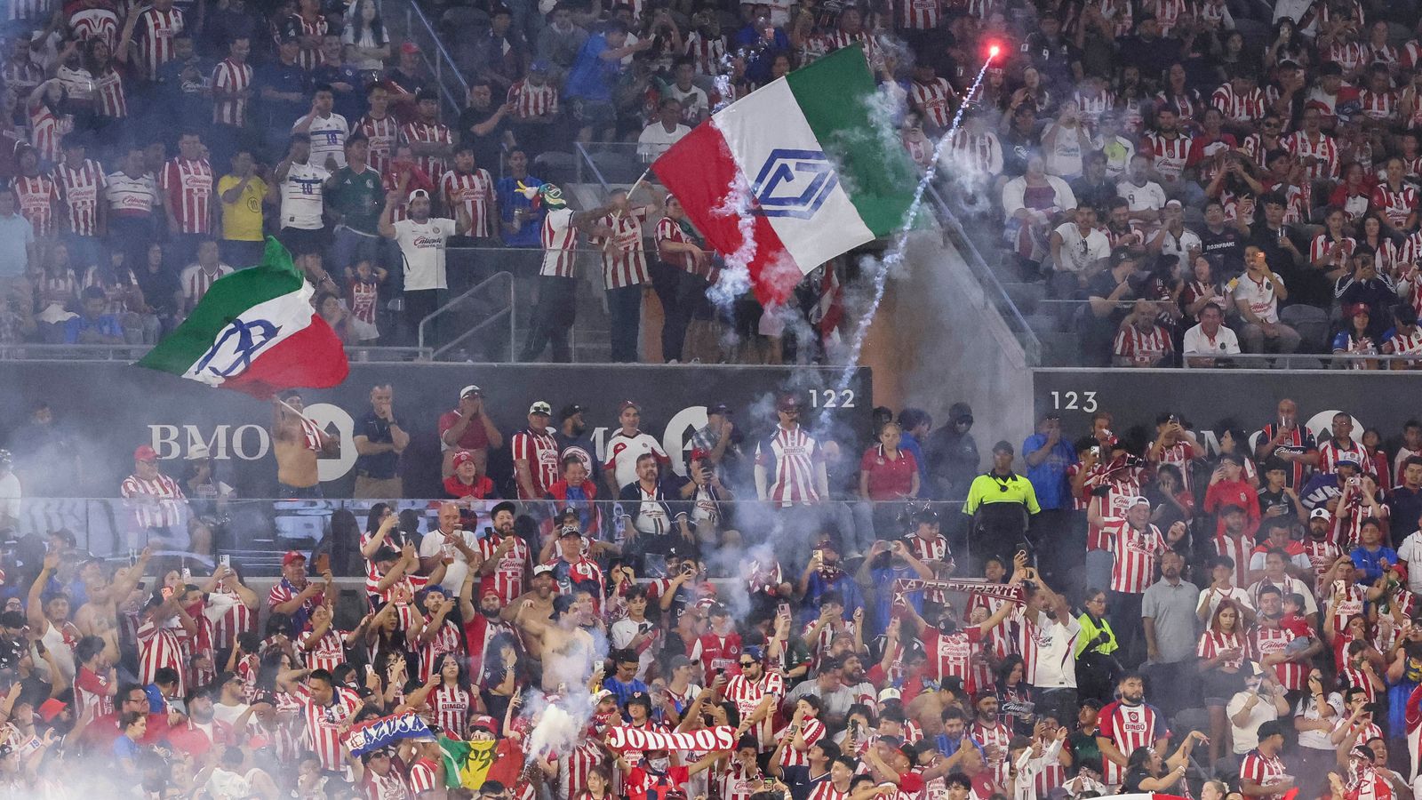 Chivas fans light flares in celebration during the match