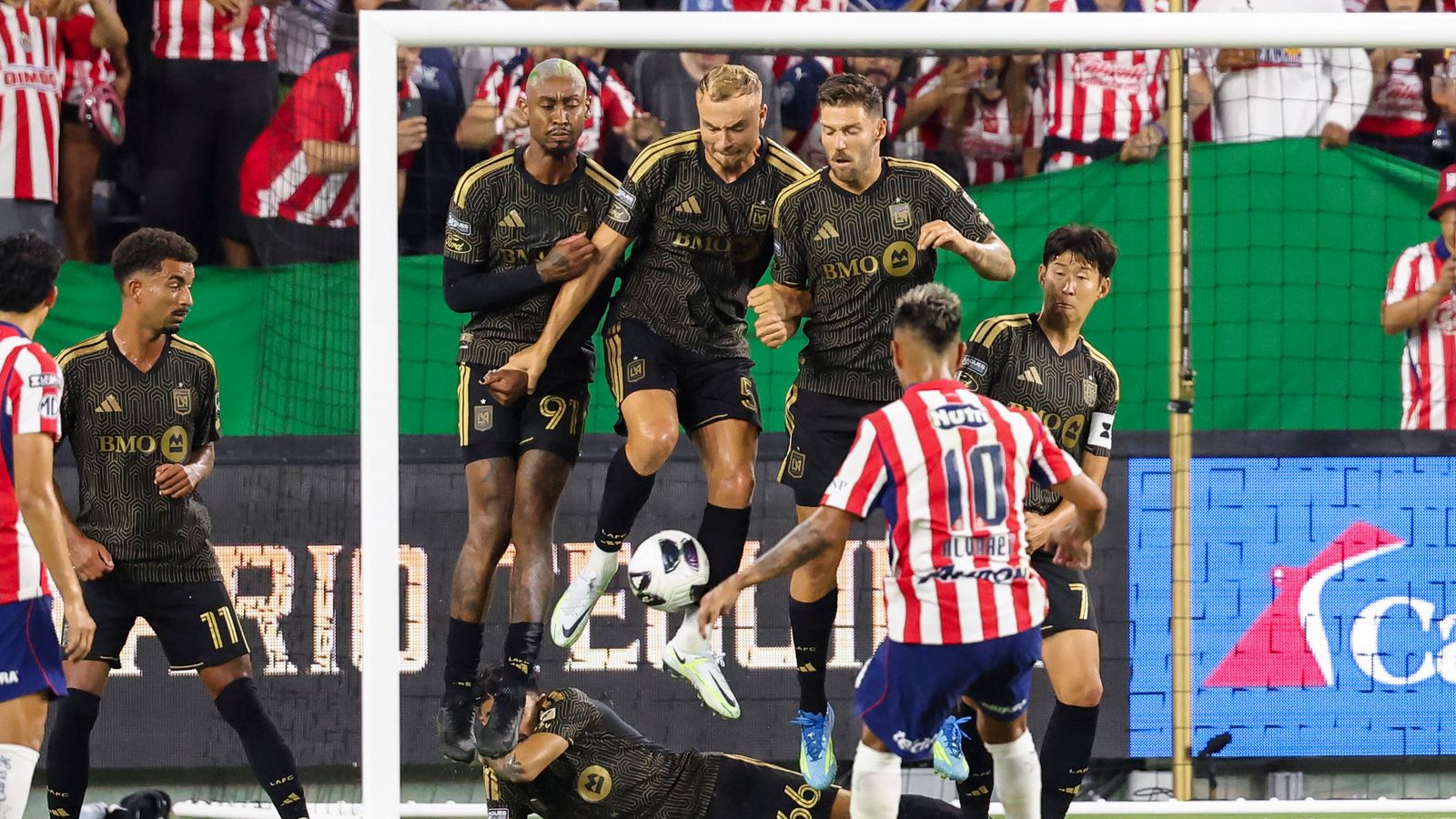 LAFC players block a free kick by Efrain Álvarez