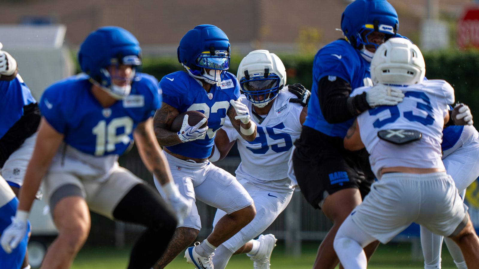 Myles Garrett #95 chases Kyren Williams #23 at training camp.