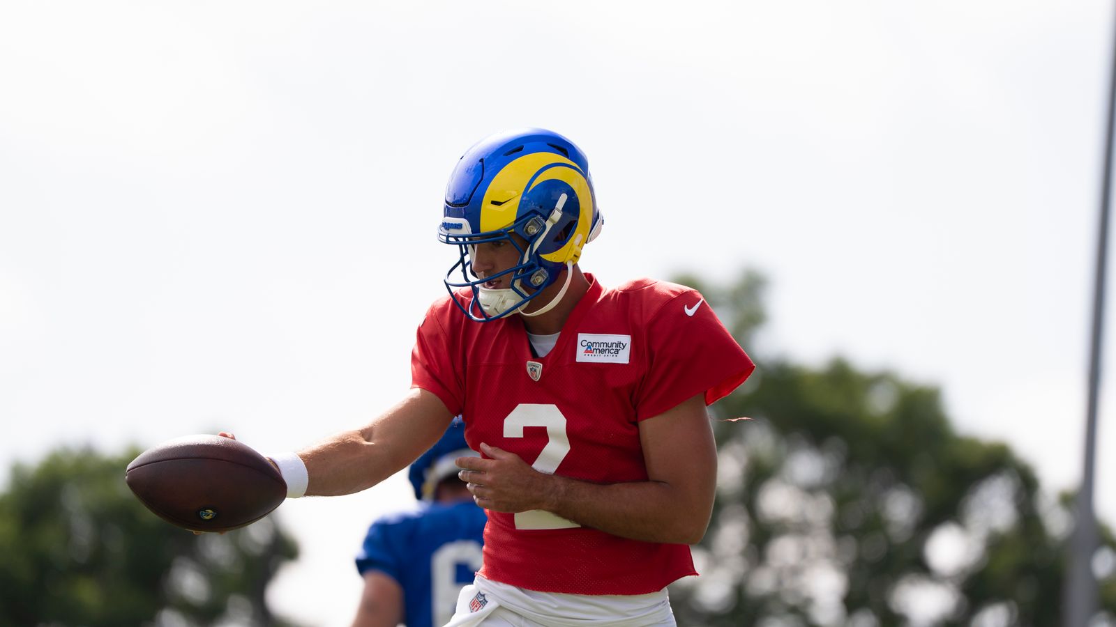 Matthew Caldwell #2 throws at Rams training camp.