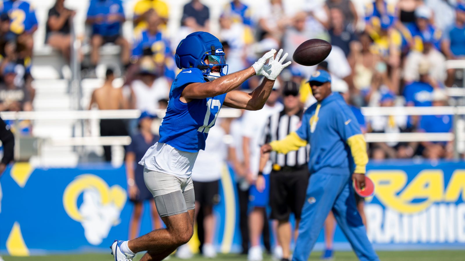 Puka Nacua #12 catching a pass at Rams training camp