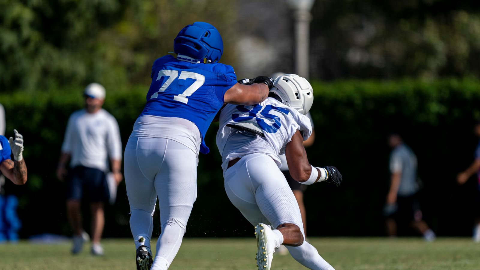 Alaric Jackson #77 blocks Myles Garrett #95 at Rams training camp