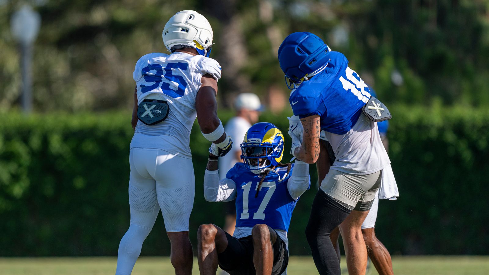 Davante Adams #17 helped up by teammates at Rams training camp