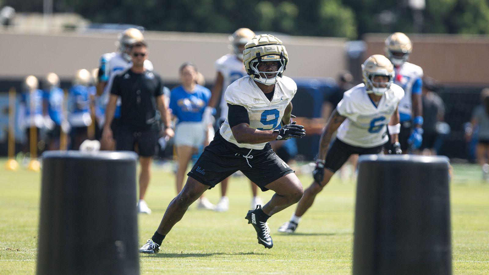 Jalen Woods runs drills at UCLA practice in Los Angeles.