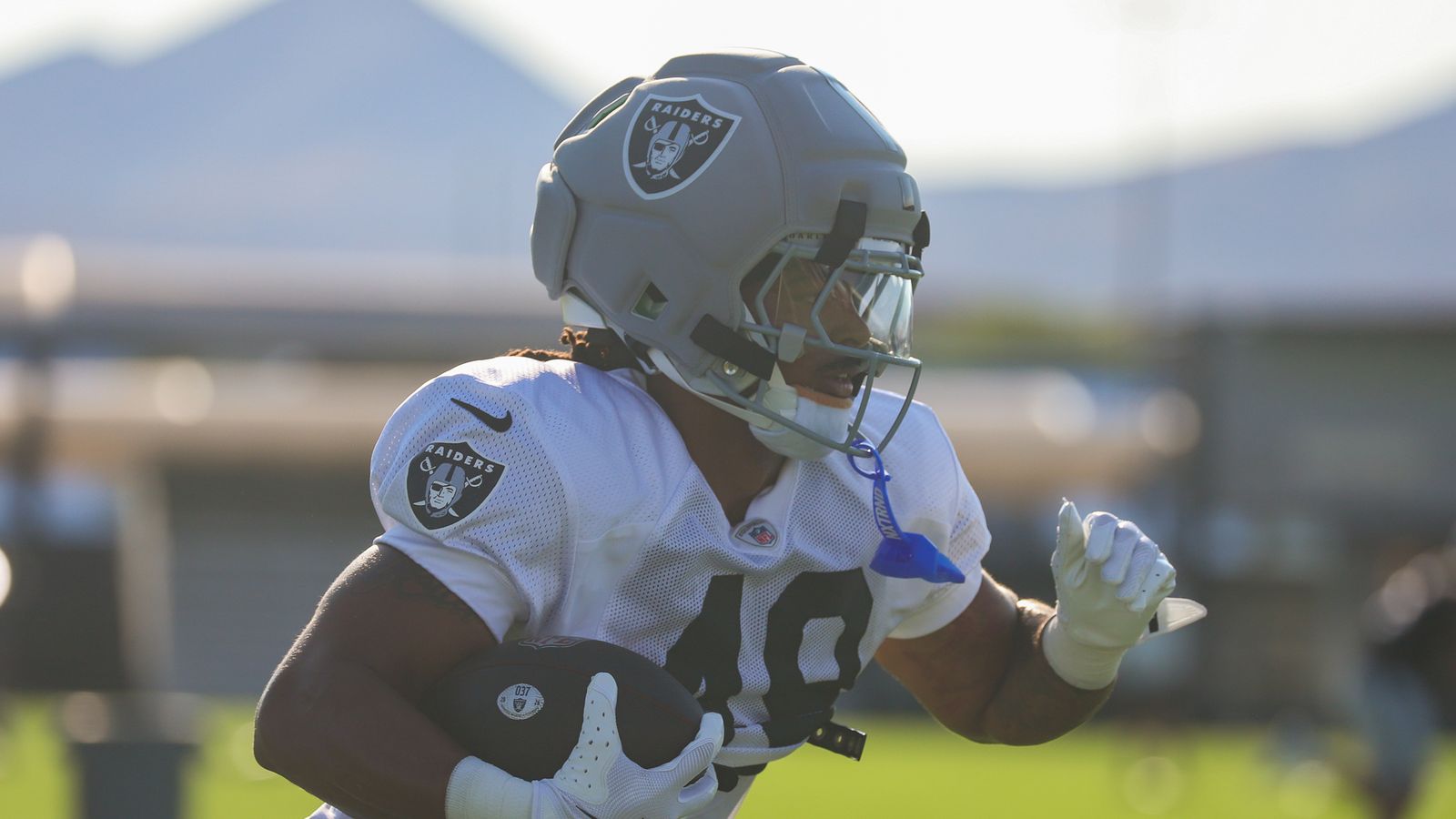 Safety Devyn Perkins runs with the ball at Raiders Camp