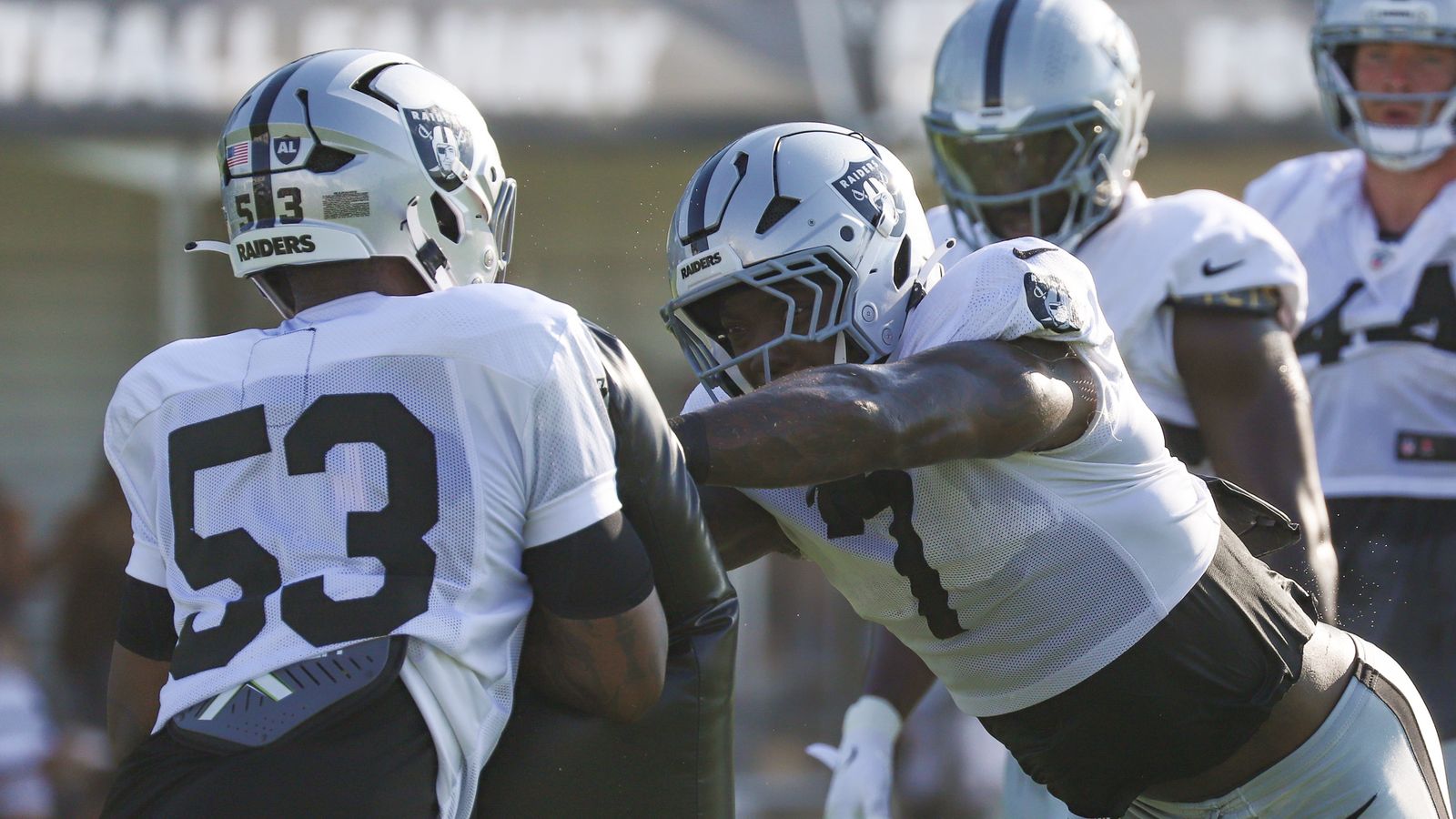 Quay Walker maneuvers past Xavian Sorey Jr. in training