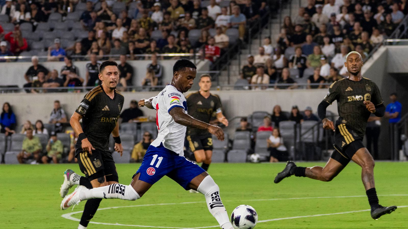 Helinho takes a shot in a tense match against LAFC