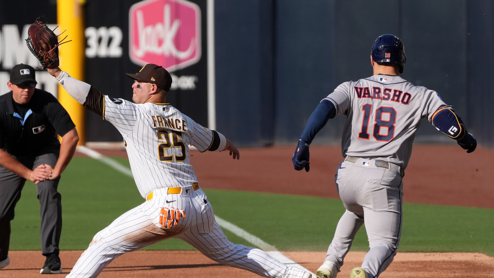 Daulton Varsho gets out at first against the Padres