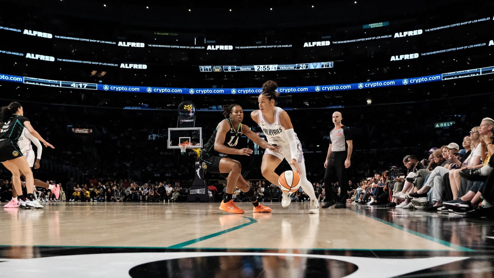 Veronica Burton dribbling in a WNBA game against the Sparks.