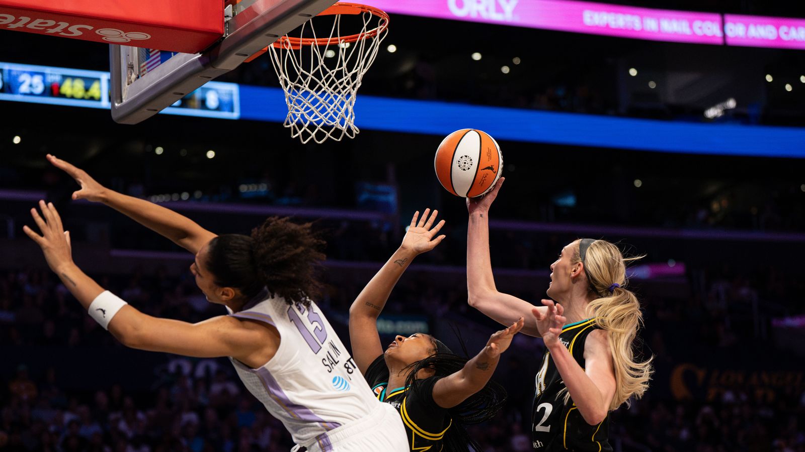 Cameron Brink grabs a rebound in WNBA game, Sparks vs Valkyries.