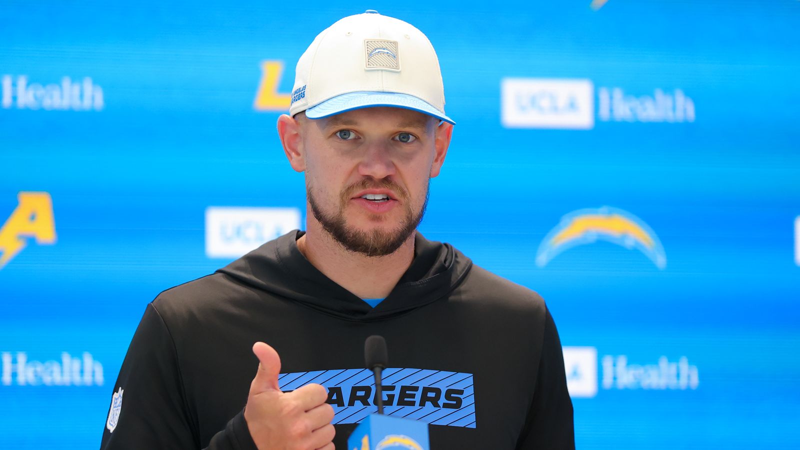 Chris O'Leary discusses strategies with media at Chargers Camp